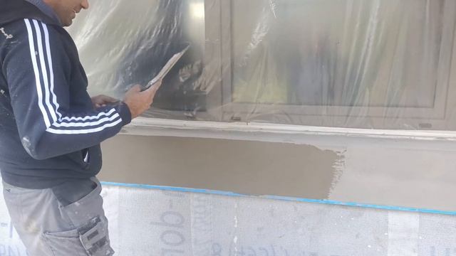Базовый армирующий слой из клея и Фасадной Стеклотканевой Сетки, перетяжка базы клеем перед финишем