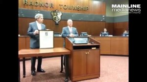 Radnor Commissioner James Higgins reads proclamation for retiring Commissioner William Spingler.