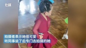 Cute little Chinese girl dances in competition with strong passion and determination