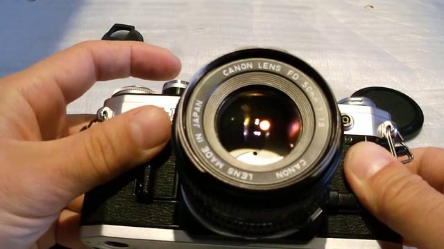 Canon AT-1 35 mm SLR camera with other photo things (vintage) смотреть онлайн