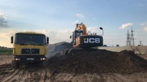 Аренда гусеничного экскаватора JCB JS 205 - погрузка грунта, строительство здания