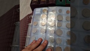 Обзор оформления нумизматической коллекции монет разных стран мира в альбомах.