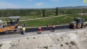 Реконструкция плотины Тайганского водохранилища. Укладка Финишного слоя асфальтобетона