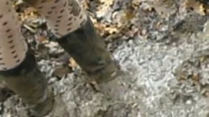 Black Stiletto Boots in mud