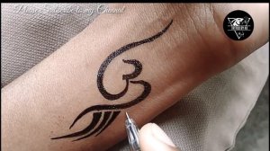 Beautiful and simple Om Tattoo by Tattoo by KK