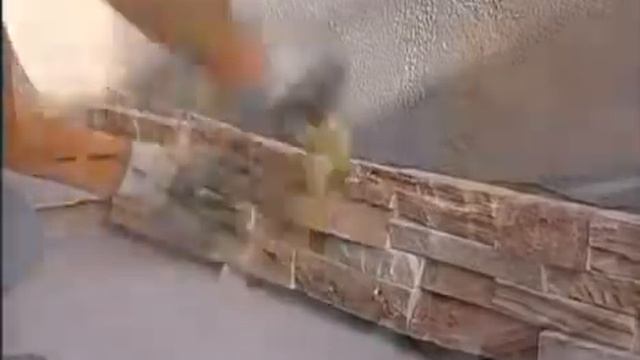 Отделка фасада современного дома камнем