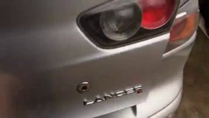 Штатная кнопка багажника  Lancer X