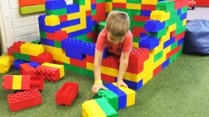 Roma plays at Indoor Playground for kids with Giant Toys and Ski simulator