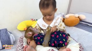 Diem is so cute lulling monkey Kaka to sleep in new bed