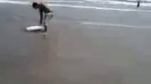 My brother attempting to skimboard on Mustang Island