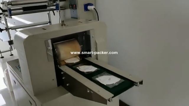 Автоматическая упаковка медицинских масок
