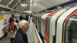 Oxford Circus Station, Victoria Line, going north. London Underground tube trains, with conductors.