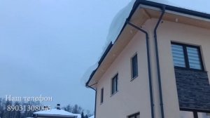 Гараж прямоугольной трапецией из сэндвич панелей с хозблоком.
