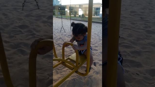 Baby Helen enjoying herself at the playground