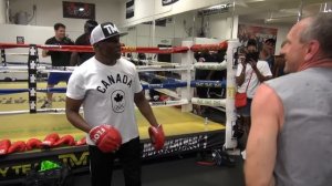 Floyd Mayweather Sr. teaching the shoulder roll to some novices inside the Mayweather Boxing Club