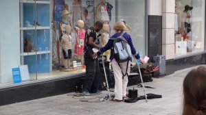 DISABLED WOMAN ATTACKS  BUSKER VERBALLY IN LIVERPOOL.  The people of Liverpool support this busker.