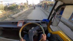POV Bus Driving In City Narrow Road