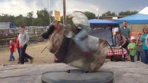 Young Bull Rider JC Mortensen on mechanical bull at Prescott rodeo