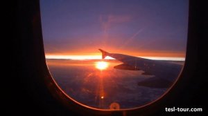 Красный закат солнца из окна самолёта (Red sunset from the window of airplane)