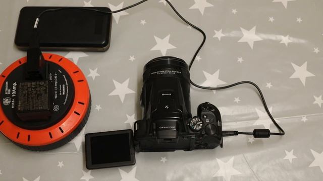 How to use a Nikon P900 while charging it смотреть онлайн