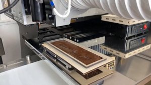 Робот для розлива шоколада от KADZAMA — автоматическая линия.