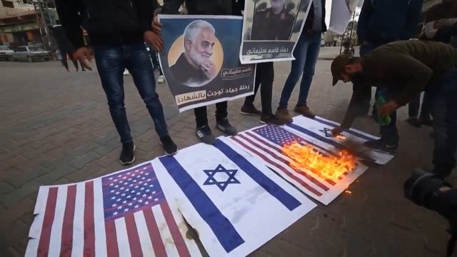 Palestinians burn US Israeli flags to protest Qasem Soleimanis death  AFP