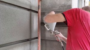 Напыление минеральной декоративной штукатурки на фасады дома, утеплённые минеральной ватой СФТК