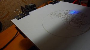 Burning paper with a homemade laser engraver on the basis of a 3D printer.