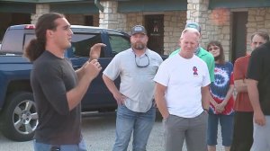 Greg Kelley speaks outside Burnet police headquarters