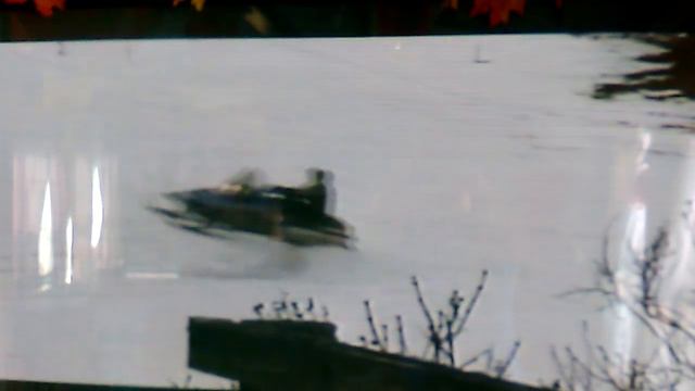 Snowmobile jumping on a homemade snow ramp in Vermont смотреть онлайн