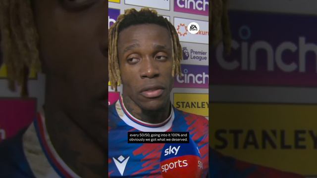 Wilfried Zaha reacts to former team-mate Aaron Wan-Bissaka's last minute challenge on him last nigh