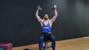 Как накачать плечи? Жим гантелей сидя параллельным хватом.