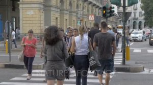 Pedestrians outside Torino Porta Nuova railway station in Turin, Italy, Europe