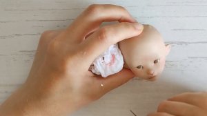 Роспись лица куклы.