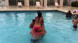 The girls playing chicken in pool