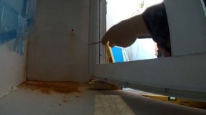 Дверцы под окном с обшивкой