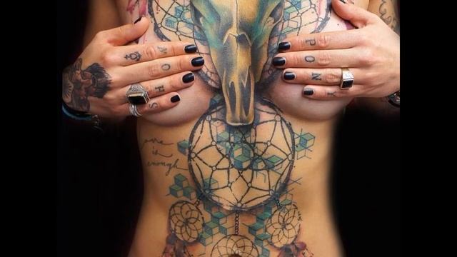 татуировки на женской груди/tattoos on a woman's breasts