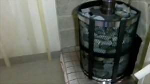 Укладка камня в банную печь.