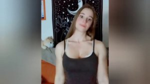 Beautiful muscular woman flexing biceps