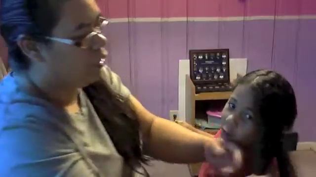 zion getting hair done with shea butter