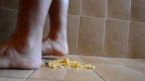 Boy feet banana crush - barefoot male fruit stomp