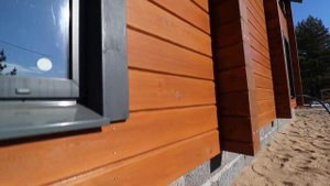 Каркасный дом с имитацией под деревянный дом из клееного бруса