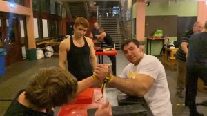 Armwrestling without fingers with an open hand, just straps