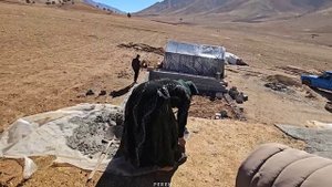 "Resilience:?? rebuilding the slope and cementing the roof of a nomadic house after a severe storm"