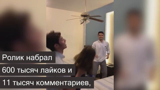 Маленькая девочка в восторге от того, что с ней вытворяют трое парней