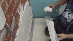 Штукатурка кирпичных стен внутри помещения.