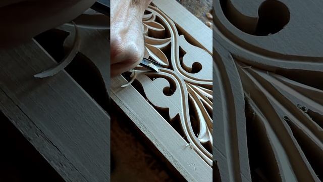 Woodcarver works on decorative linden panels