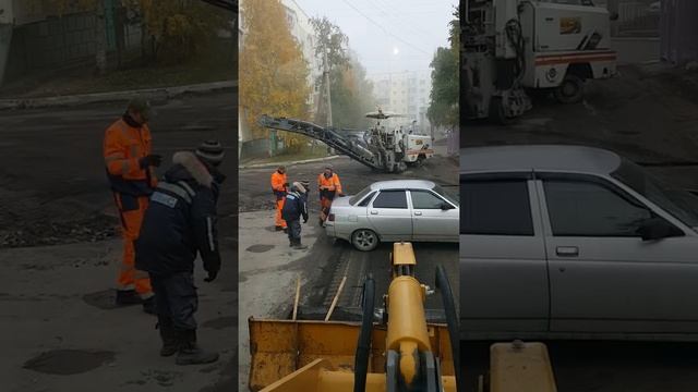 В городе Нефтеюганске делают ямочный ремонт машины передвигают в ручную с места на место смотреть онлайн