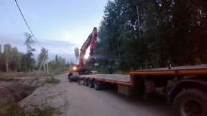 Неудачная погрузка экскаватора на трал