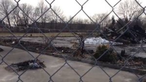 Baumann Superette owner Steve Baumann discusses the store future with Frank Lynch. The store burned